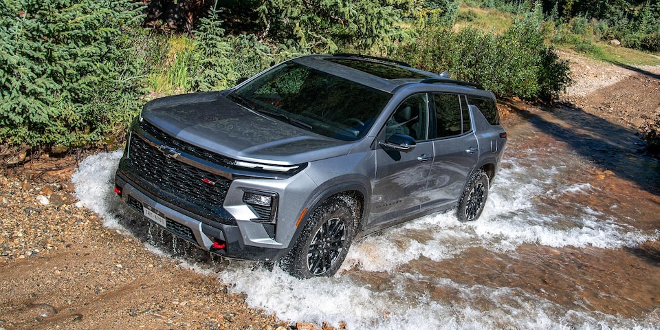 2024 Chevy Traverse Driving Uphill on a Gravel Path