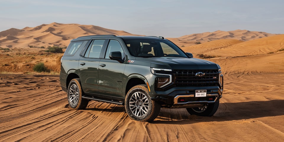 Rear Three-quarters View of the 2025 Chevrolet Tahoe SUV Parked on the Sand