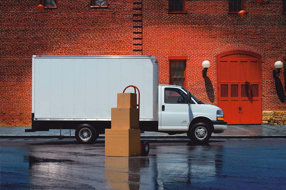 2024 Chevy Express Cargo Van Towing a Trailer on Country Roads