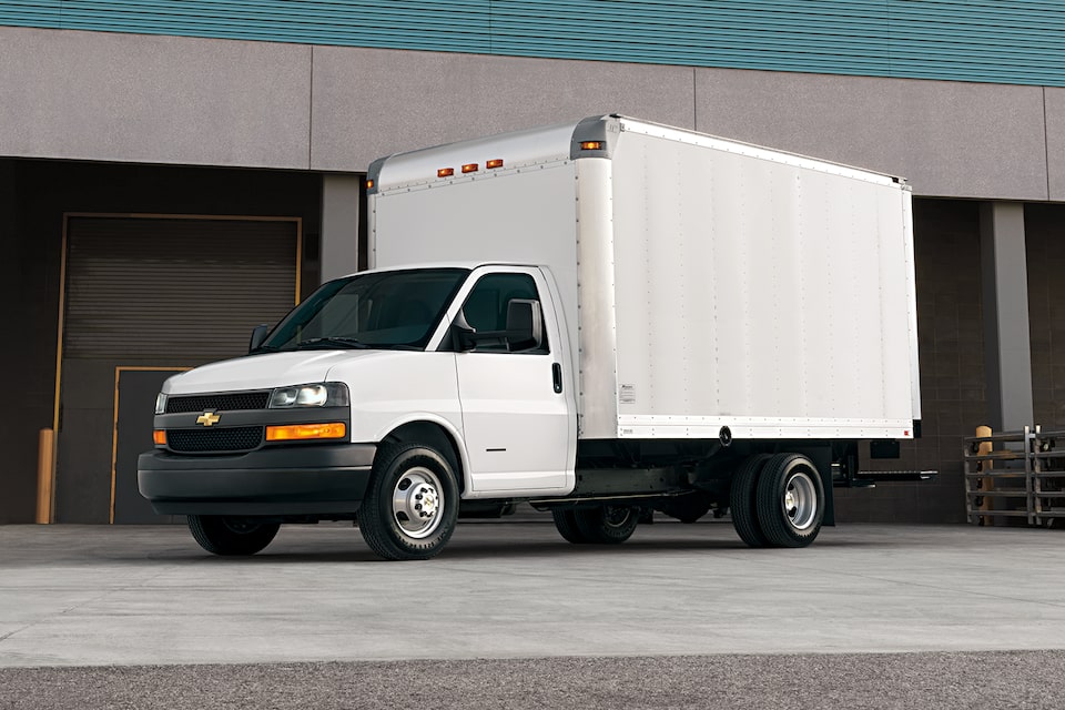 2024 Chevy Express Passenger Van Parked at Airport